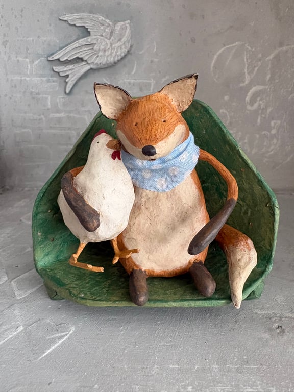 Paper mache fox with chicken