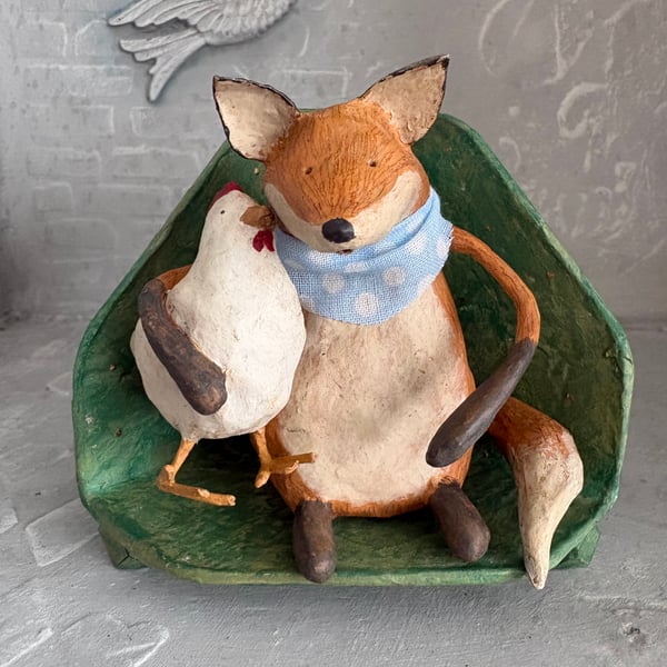 Paper mache fox with chicken