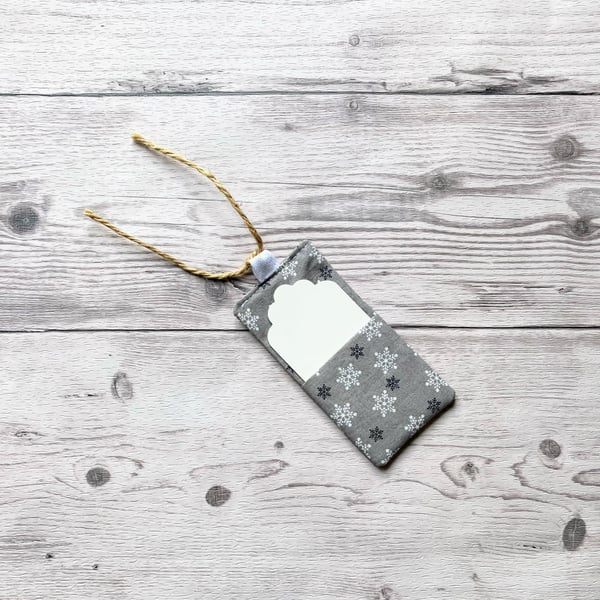 Snowflake Christmas themed silver cotton fabric gift tags with card.