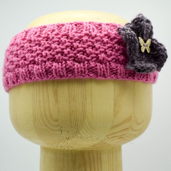 Hand Knitted "Daisy" Head band in pink with a mauve flower