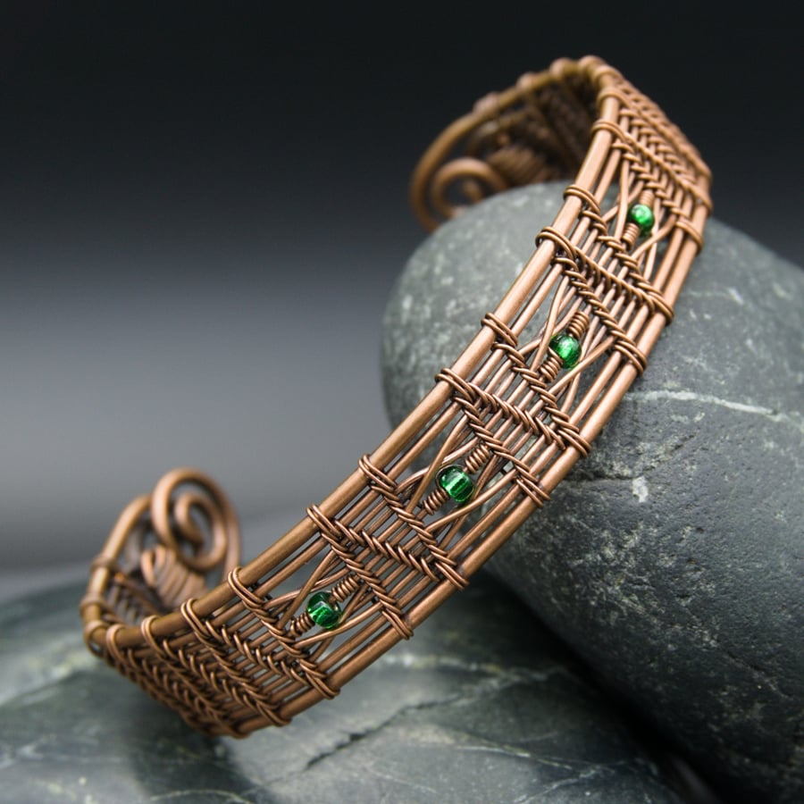 Woven zigzag copper cuff with green beads