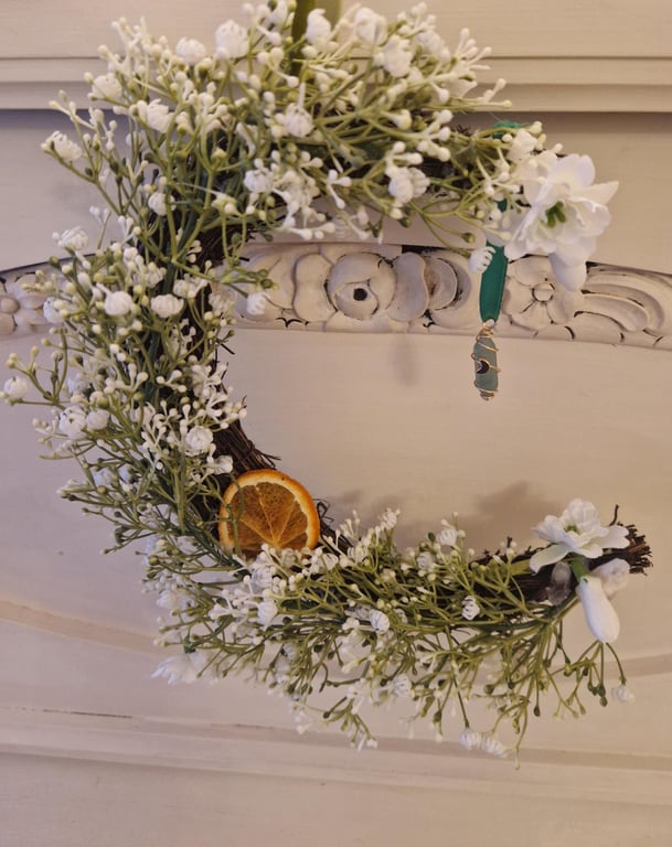 Imbolc, Spring, Brigid, Crescent Moon Wreath with snowdrops and crystals.