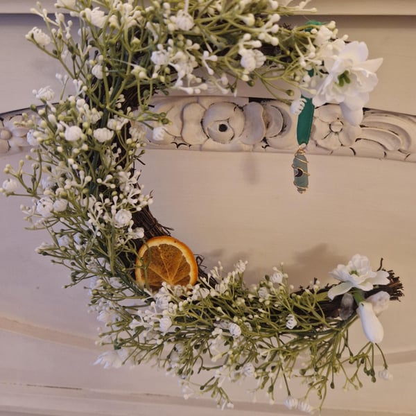 Imbolc, Spring, Brigid, Crescent Moon Wreath with snowdrops and crystals.
