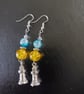 Silver lighthouse charm dangle earrings with yellow and blue beads
