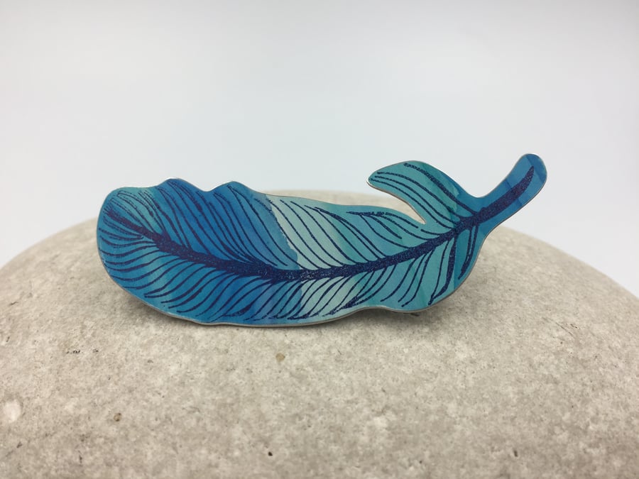 Hand painted and printed anodised aluminium feather brooch