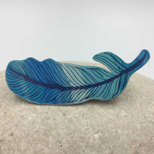 Hand painted and printed anodised aluminium feather brooch
