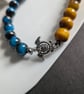 Blue and yellow bracelet with turtle - Image 2