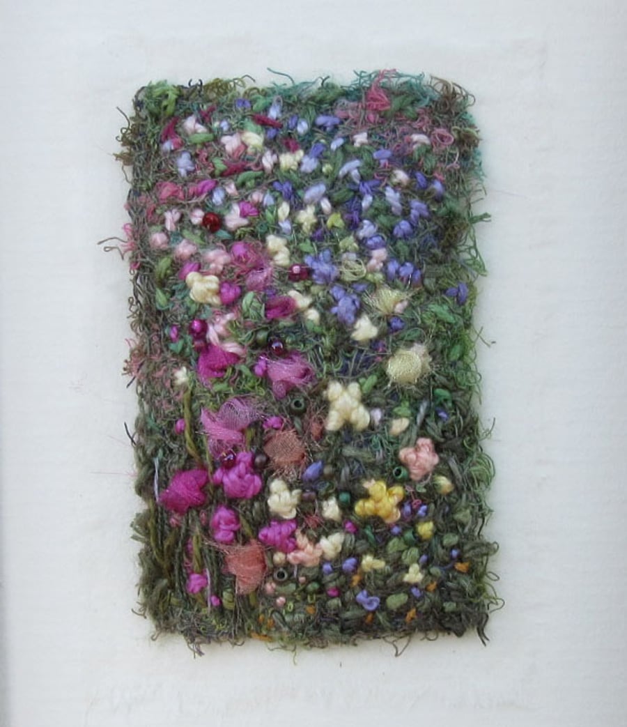 EMBROIDERED FLOWER GARDEN PICTURE in light frame