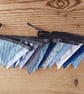 Handmade mini bunting in a blue theme.