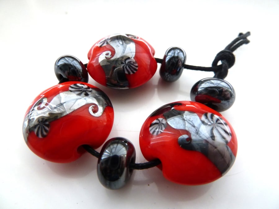 red and grey lampwork glass beads