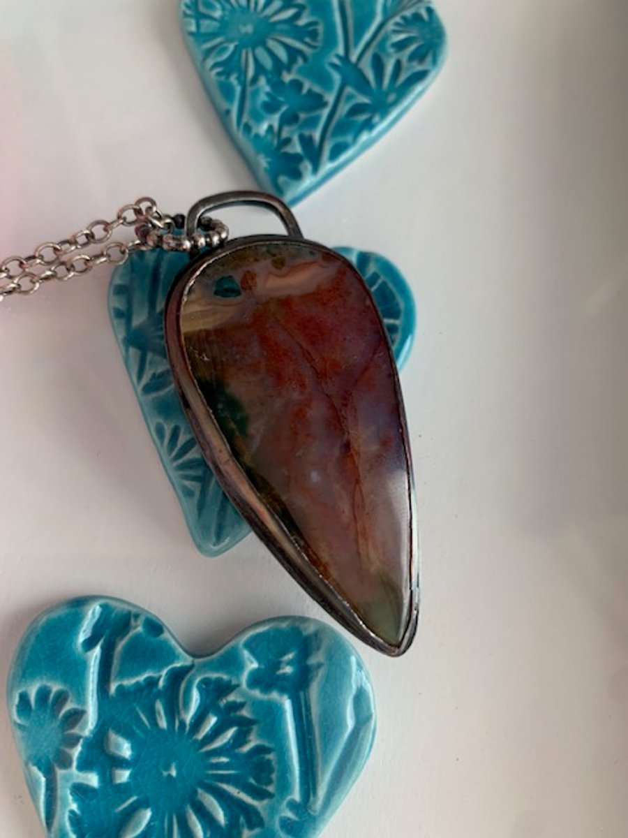 Sterling silver Red moss Pendant with a tree design on the back