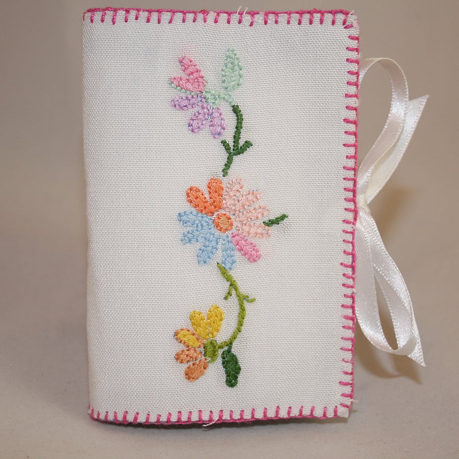 Needle book featuring bright daisies from recycled linen