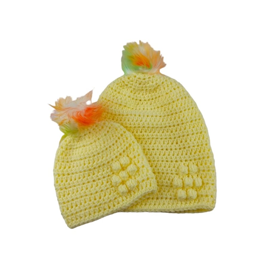 Matching ladies and baby lemon crocheted hats with detachable faux fur pompoms 