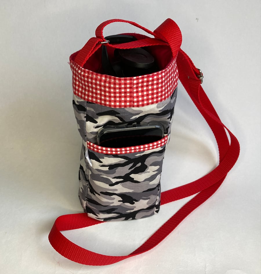 Water bottle carrier with pocket for phone. Grey camouflage with red trim