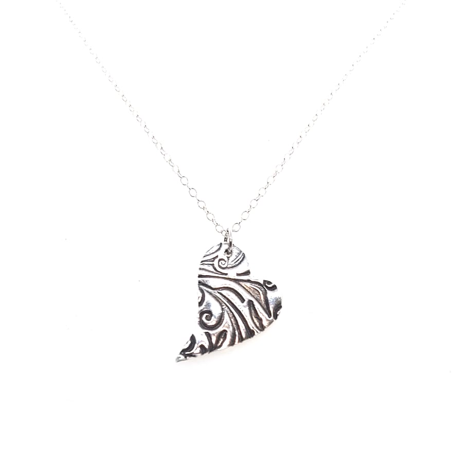 Silver patterned asymmetric heart pendant necklace