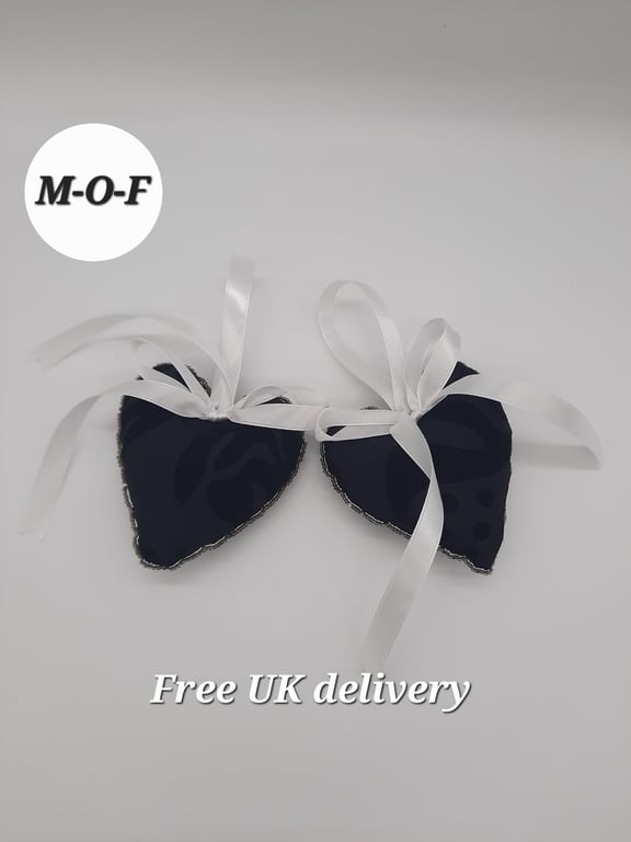 Heart hanger pair in black with with ribbon and seed bead edging. 