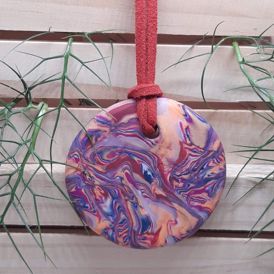 Round polymer clay pendant in bright pink colours