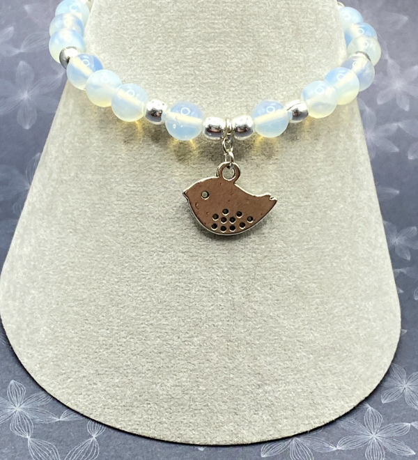 Stretchy bracelet with opalite stones and silver plated bird charm