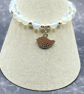 Stretchy bracelet with opalite stones and silver plated bird charm - Image 1