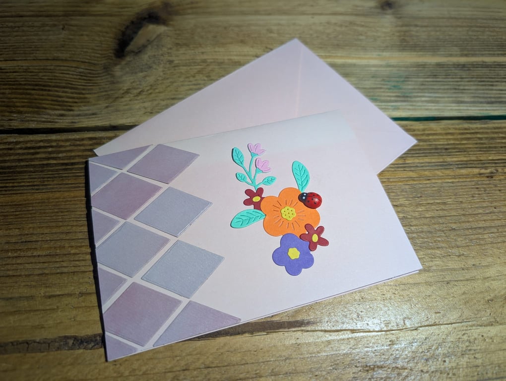 Handmade floral design card with ladybird embellishment