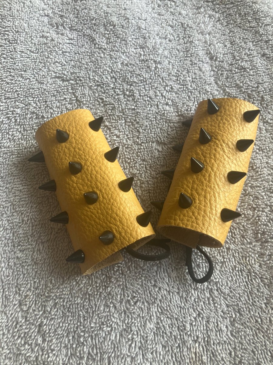 Yellow Leather with Black Spikes: Wheelchair Handle Deterrents (WHDs)