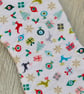 Hanging Christmas Stocking with scattered Christmas motifs. - Image 3