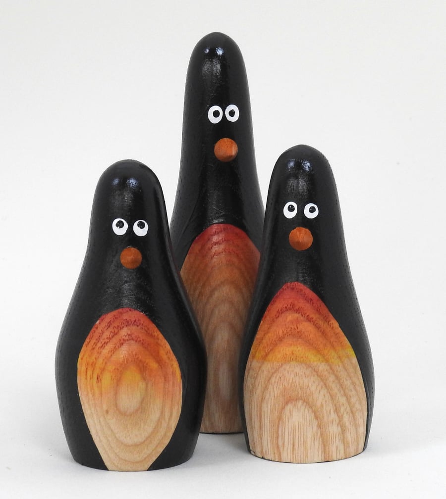 Wooden pengiun trio