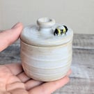 Small ceramic lidded blue pot with mini bee