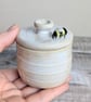 Small ceramic lidded blue pot with mini bee
