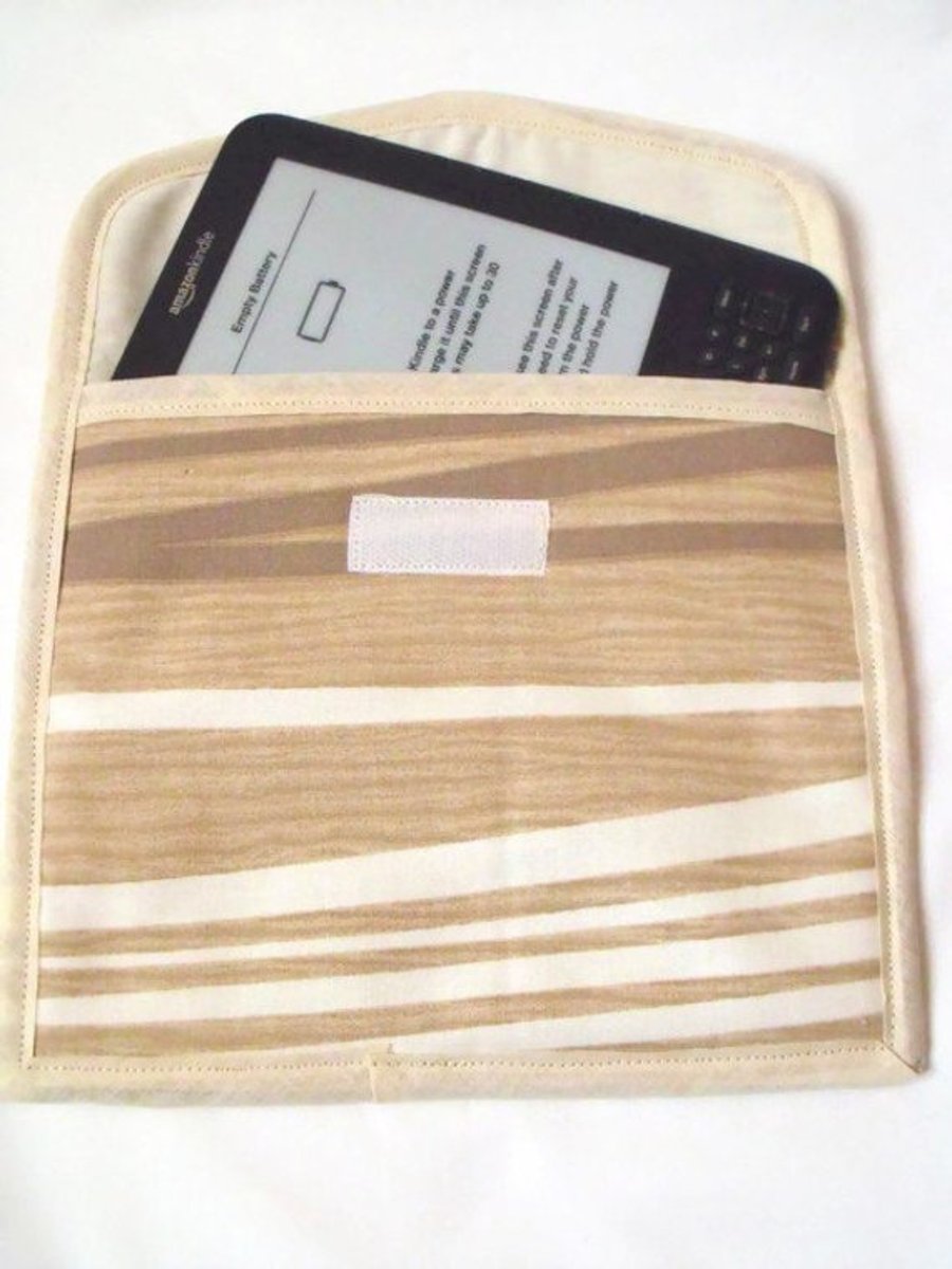 beige abstract tablet sleeve for e reader, kindle etc, aprox 7.5 x 8.5 inches