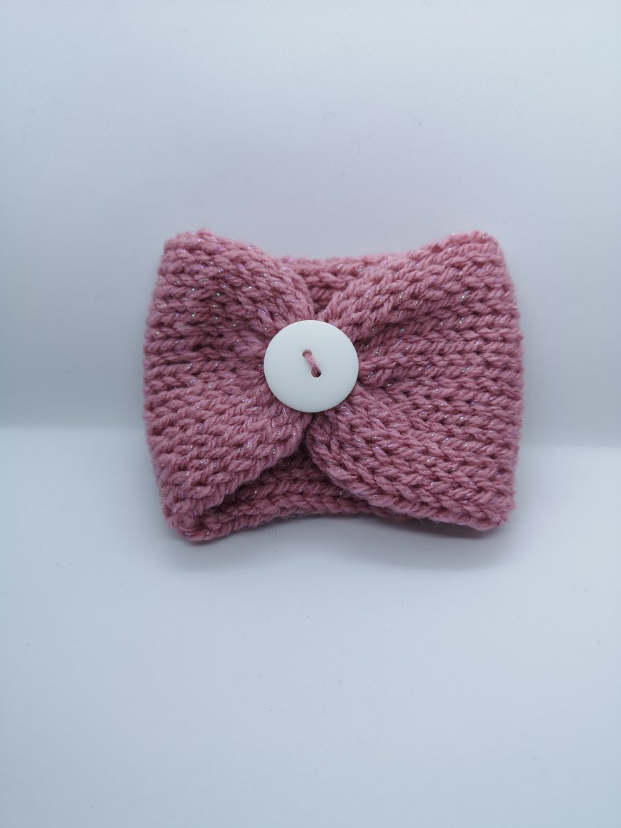 Handknitted pink glittery cup cosie