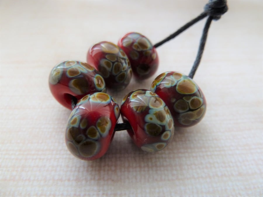 red raku handmade lampwork glass beads