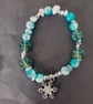 Elasticated winter beaded bracelet with crystal chip and snowflake charm - Image 2
