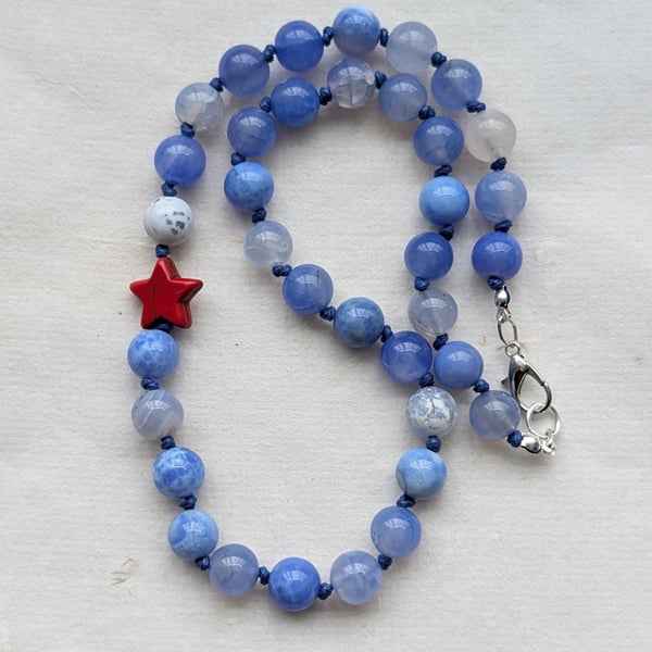 Blue fire agate knotted necklace with red howlite star 