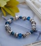 Silver and blue bead stretch bracelet - Image 4
