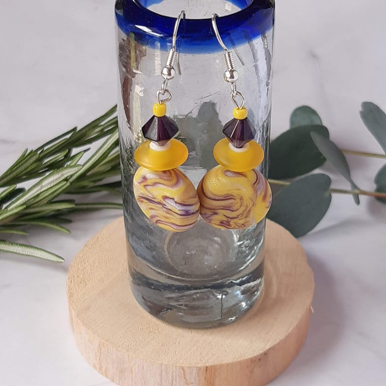 Handmade dangly  polymer clay disc earrings in yellow and purple