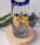 Handmade dangly  polymer clay disc earrings in yellow and purple