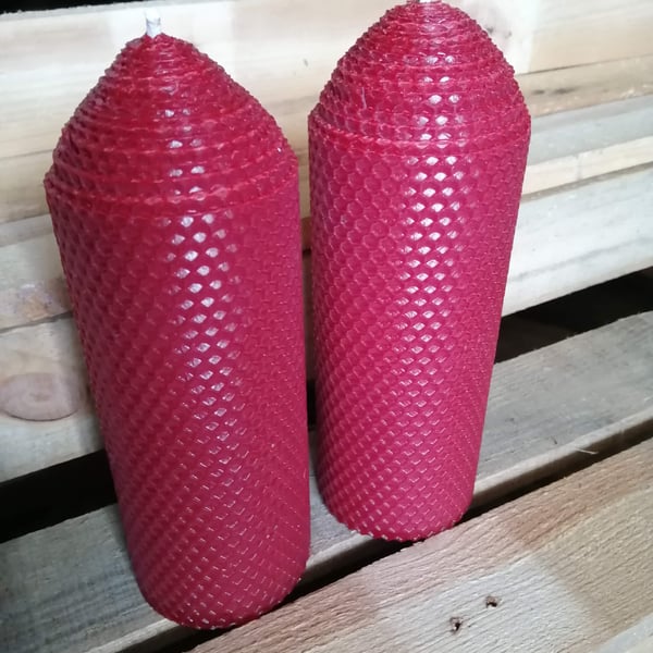 A pair of Dark Red rolled beeswax candles 70mm diameter x 195mm high