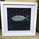 Hand embroidered fish in the sea.
