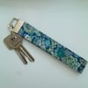 Key ring wrist strap in blue green Liberty fabric