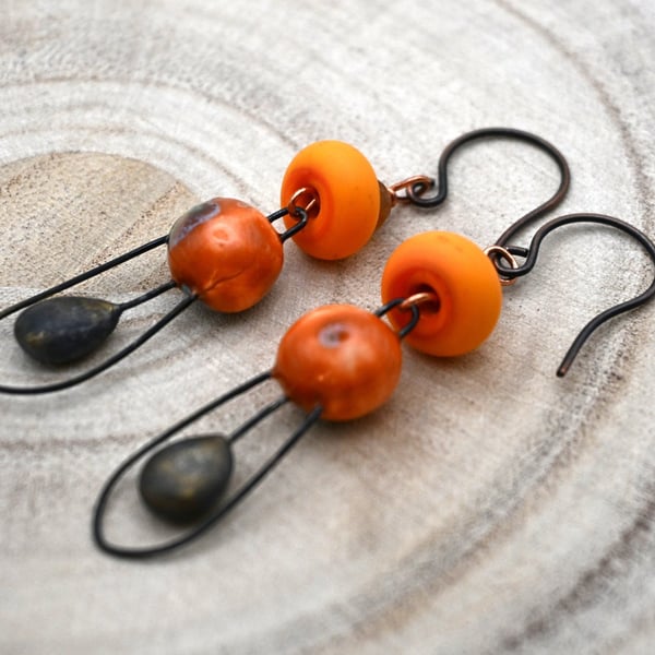 copper, orange lampwork glass and ceramic earrings