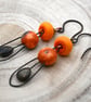 copper, orange lampwork glass and ceramic earrings
