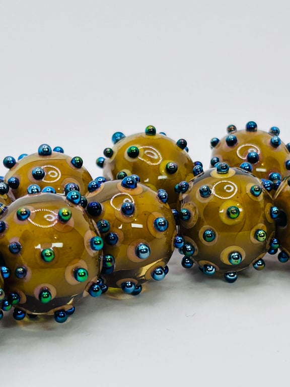 Handmade brown and iridescent spotty lamp work glass beads