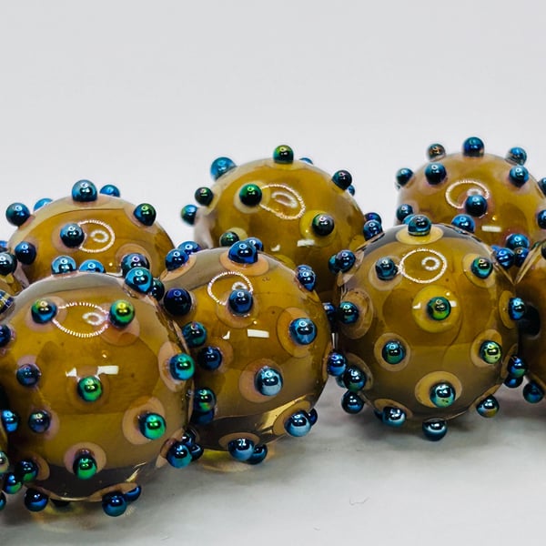 Handmade brown and iridescent spotty lamp work glass beads