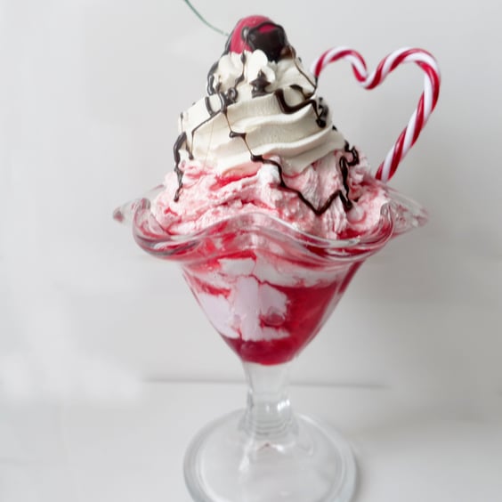 Pink themed fake food sundae with candy cane heart.  Prop food.  Kitchen Kitsch.