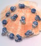 Bracelet and Earring Set Made with White Ceramic Beads with Blue Pattern - Image 1