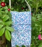 Teal blue floral crossbody bag.