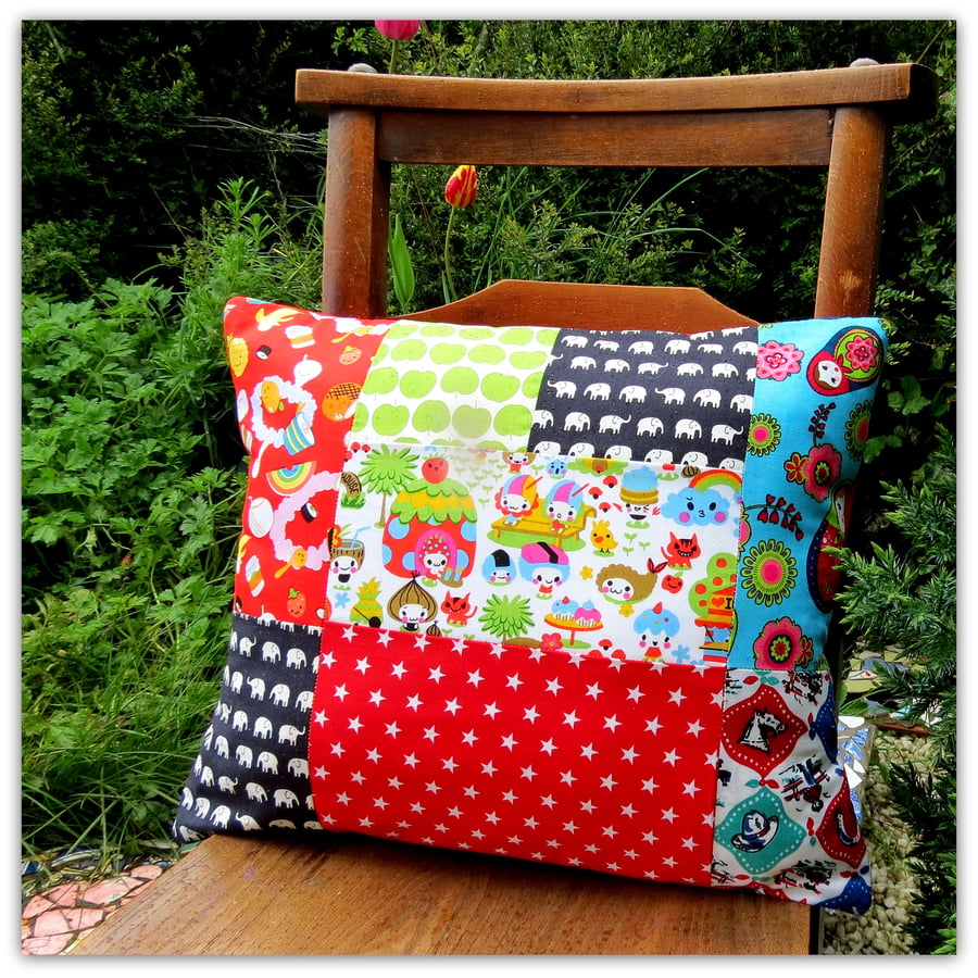 Vibrant patchwork cushion, complete with inner pad.  