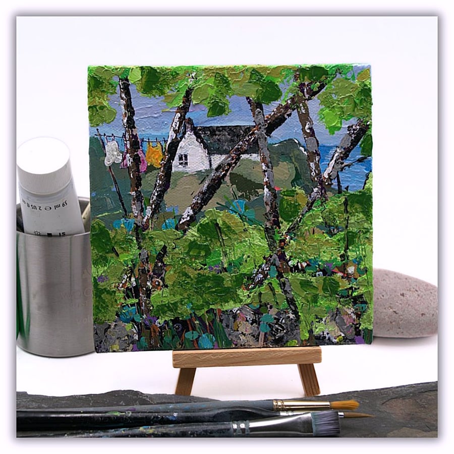 A small original painting - coastal landscape - washing day - with easel