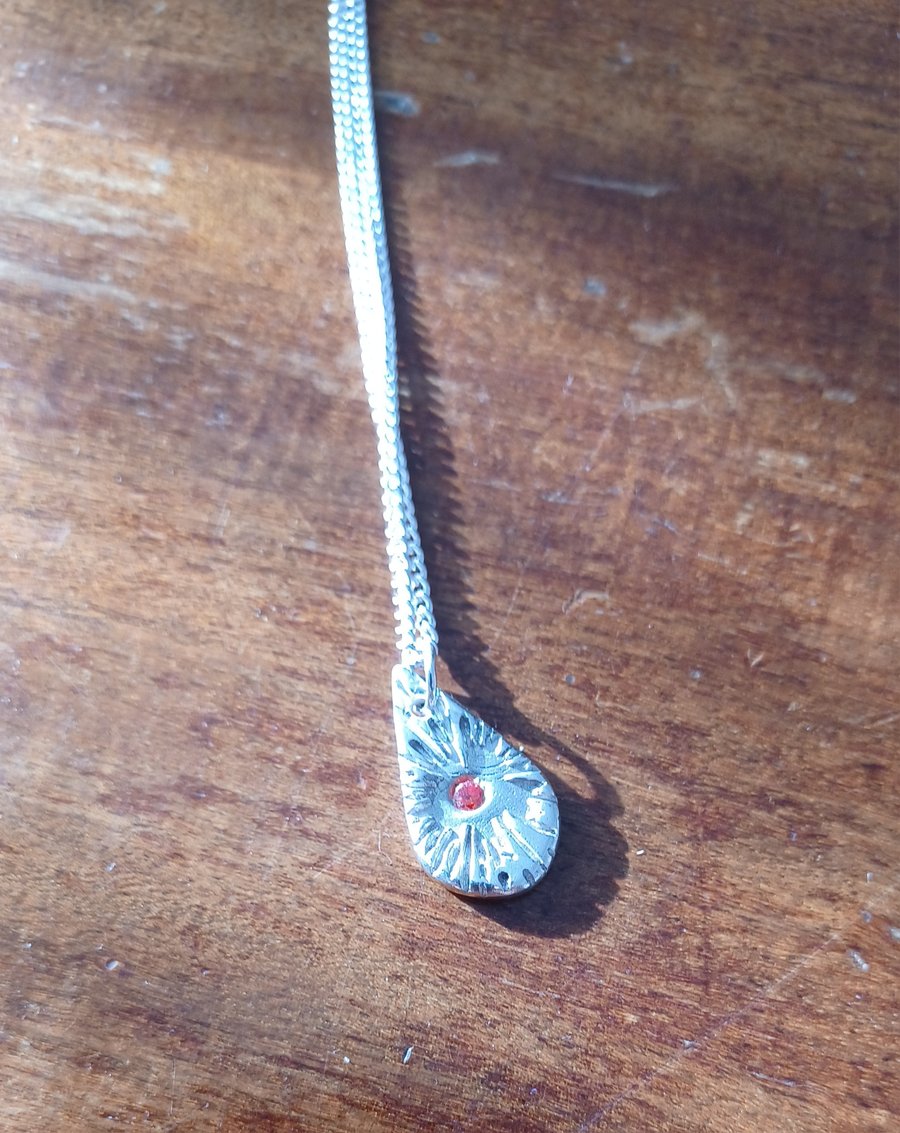 Teardrop sunburst pendant